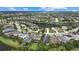 Aerial view of a large community with houses, streets, and a lake at 12224 Longview Lake Cir, Bradenton, FL 34211
