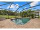 Screened-in pool with brick pavers is surrounded by lush landscaping with views of the backyard and nearby park at 12224 Longview Lake Cir, Bradenton, FL 34211