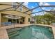 Sparkling in-ground pool with a screened enclosure, brick paver deck, exterior dining area, and outdoor sofa seating at 12224 Longview Lake Cir, Bradenton, FL 34211