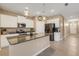 Modern kitchen with white cabinets, granite counters, and stainless steel appliances at 13707 Woodbridge Ter, Bradenton, FL 34211