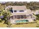 Aerial view showcasing home and screened pool area at 14106 18Th E Pl, Bradenton, FL 34212