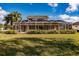 Large backyard with home and screened pool area at 14106 18Th E Pl, Bradenton, FL 34212