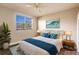 Virtually staged bedroom with a comfortable bed and ocean decor at 14106 18Th E Pl, Bradenton, FL 34212