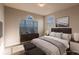 Cozy bedroom with a queen bed and stylish decor at 14106 18Th E Pl, Bradenton, FL 34212