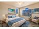 Virtually staged bedroom with a king-size bed and beach decor at 14106 18Th E Pl, Bradenton, FL 34212