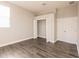 Well-lit bedroom with hardwood floors and closet at 14106 18Th E Pl, Bradenton, FL 34212