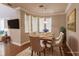 Spacious dining area with hardwood floors and a decorative rug at 14106 18Th E Pl, Bradenton, FL 34212
