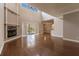 Gathering room with fireplace, hardwood floors, and pool view at 14106 18Th E Pl, Bradenton, FL 34212