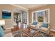 Virtually staged living room with hardwood floors and comfy seating at 14106 18Th E Pl, Bradenton, FL 34212