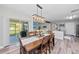 Dining room with wooden table, chairs, and sliding doors to the patio at 15218 Agave Grove Pl, Bradenton, FL 34212