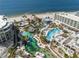 Drone view showcasing resort pools, beach, and oceanfront location at 1561 Gulf Of Mexico Dr # 403, Longboat Key, FL 34228