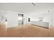 Modern kitchen with white cabinets and island at 1561 Gulf Of Mexico Dr # 403, Longboat Key, FL 34228