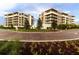 Luxury resort building exteriors with landscaping at 1561 Gulf Of Mexico Dr # 403, Longboat Key, FL 34228