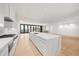 Open concept kitchen with island, marble countertops and ocean views at 1561 Gulf Of Mexico Dr # 403, Longboat Key, FL 34228