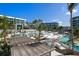 Expansive pool area with multiple pools, lush landscaping and modern architecture at 1561 Gulf Of Mexico Dr # 403, Longboat Key, FL 34228
