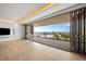 Living room with ocean views and access to a large balcony at 1561 Gulf Of Mexico Dr # 403, Longboat Key, FL 34228