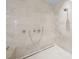 Spa-like shower with multiple shower heads and marble tile at 1561 Gulf Of Mexico Dr # 403, Longboat Key, FL 34228