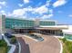 Luxury building exterior with fountain and ample parking at 1561 Gulf Of Mexico Dr # 403, Longboat Key, FL 34228