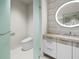 Modern bathroom with a sleek toilet and floating vanity at 1561 Gulf Of Mexico Dr # 403, Longboat Key, FL 34228