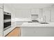 Modern kitchen with stainless steel appliances and marble at 1561 Gulf Of Mexico Dr # 403, Longboat Key, FL 34228