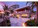 Outdoor resort restaurant with patio seating at sunset at 1561 Gulf Of Mexico Dr # 403, Longboat Key, FL 34228