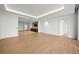 Open living space with wood floors and modern wet bar at 1561 Gulf Of Mexico Dr # 403, Longboat Key, FL 34228