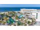 Luxury beachfront resort with multiple pools, ocean views, and lush landscaping at 1561 Gulf Of Mexico Dr # 403, Longboat Key, FL 34228