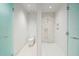 Modern bathroom with walk-in shower and mosaic tile at 1561 Gulf Of Mexico Dr # 403, Longboat Key, FL 34228