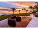 Tranquil beachfront deck with firepit and sunset views at 1561 Gulf Of Mexico Dr # 403, Longboat Key, FL 34228