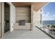 Private balcony with ocean view and outdoor grill at 1561 Gulf Of Mexico Dr # 403, Longboat Key, FL 34228