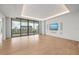 Bright living room with floor to ceiling windows and city views at 1561 Gulf Of Mexico Dr # 403, Longboat Key, FL 34228