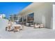 Relaxing outdoor patio with seating and modern planters at 1561 Gulf Of Mexico Dr # 403, Longboat Key, FL 34228