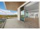 Spacious balcony with sliding glass doors and stunning water views at 1591 Gulf Of Mexico Dr # 413, Longboat Key, FL 34228