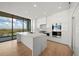 Modern kitchen with large island, stainless steel appliances, and marble countertops at 1591 Gulf Of Mexico Dr # 413, Longboat Key, FL 34228