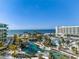 Aerial view of resort with pools and oceanfront location at 1591 Gulf Of Mexico Dr # 413, Longboat Key, FL 34228