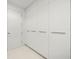 Ample storage with floor-to-ceiling white cabinets at 1591 Gulf Of Mexico Dr # 413, Longboat Key, FL 34228