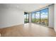 Spacious bedroom with large windows and hardwood floors at 1591 Gulf Of Mexico Dr # 413, Longboat Key, FL 34228