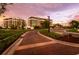 Brick pathway leads to St. Regis branded condo building entrance at 1591 Gulf Of Mexico Dr # 413, Longboat Key, FL 34228