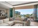 Elegant living room with modern furnishings and a balcony overlooking ocean views at 1591 Gulf Of Mexico Drive # 311, Longboat Key, FL 34228