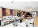 Sophisticated lounge with fireplace and grand piano at 1591 Gulf Of Mexico Drive # 311, Longboat Key, FL 34228