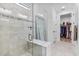 Spa-like bathroom with glass shower, built in bench and walk in closet at 16247 Hidden Oak Loop, Bradenton, FL 34211