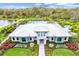 Community clubhouse with pool and landscaping at 16247 Hidden Oak Loop, Bradenton, FL 34211
