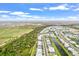Aerial view of a residential area with a canal and green spaces nearby at 16247 Hidden Oak Loop, Bradenton, FL 34211
