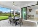 Screened patio with dining set and views of the backyard at 16247 Hidden Oak Loop, Bradenton, FL 34211
