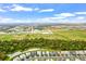 Aerial view of new homes with nearby sports fields and green spaces at 16247 Hidden Oak Loop, Bradenton, FL 34211