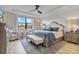 Luxurious main bedroom with king-size bed and ample natural light at 16247 Hidden Oak Loop, Bradenton, FL 34211