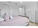 Guest bedroom with light hardwood floors and a neutral-toned bed at 16247 Hidden Oak Loop, Bradenton, FL 34211