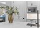 Modern kitchen features white cabinets, quartz countertops, and stainless steel appliances at 16247 Hidden Oak Loop, Bradenton, FL 34211