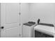 Laundry room with washer, dryer and extra storage space at 16247 Hidden Oak Loop, Bradenton, FL 34211