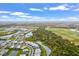 Aerial view of a residential neighborhood with lake access and recreational areas at 16247 Hidden Oak Loop, Bradenton, FL 34211